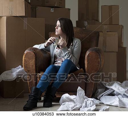 Teenage girl having coffee in new home View Large Photo Image Stock Image - Teenage girl having coffee in new home. Fotosearch