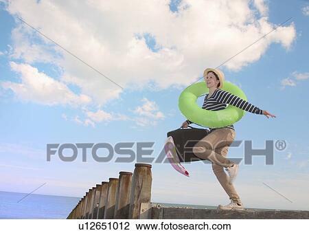 Teenage girl with suitcase on dock View Large Photo Image Stock Image - Teenage girl with suitcase on dock. Fotosearch