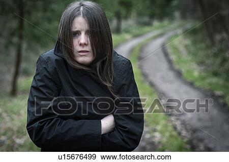 Teenage girl wrapped in parka outdoors View Large Photo Image Stock Photo - Teenage girl wrapped in parka outdoors. Fotosearch