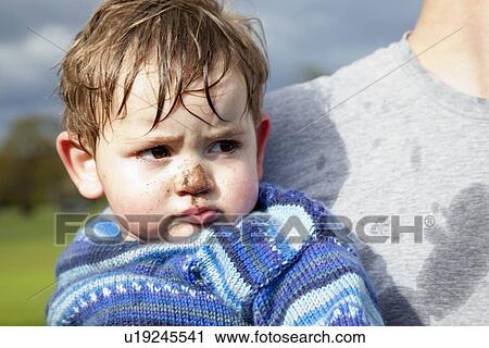 Stock Image - Toddler boy with muddy nose. Fotosearch