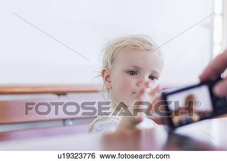 Toddler girl reaching for camera View Large Photo Image Stock Photograph - Toddler girl reaching for camera. Fotosearch
