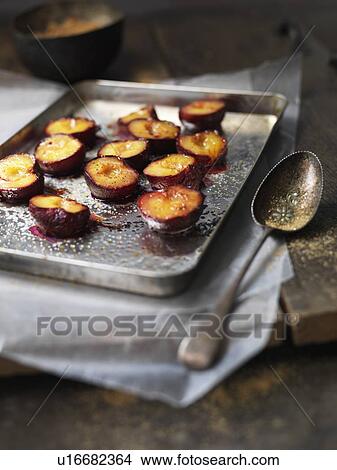 Picture - Tray of baked fruit. Fotosearch