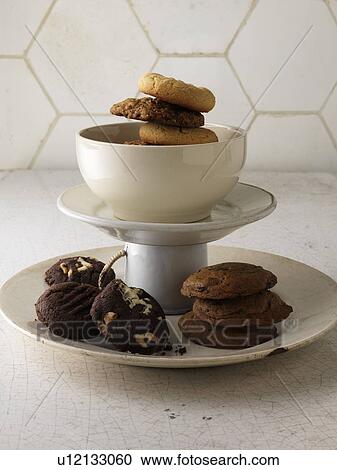 Stock Image - Various cookies on serving tray. Fotosearch