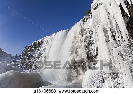 Waterfall and icicles on cliffs View Large Photo Image Stock Photo - Waterfall and icicles on cliffs. Fotosearch
