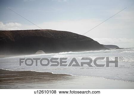 Waves crashing on sandy beach, Mirleft, Morocco View Large Photo Image Stock Photo - Waves crashing on sandy beach, Mirleft, Morocco. Fotosearch