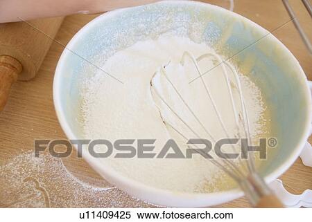 Whisk in bowl of batter in kitchen View Large Photo Image Stock Photography - Whisk in bowl of batter in kitchen. Fotosearch