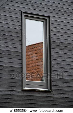 Window reflecting roof tiles View Large Photo Image Picture - Window reflecting roof tiles. Fotosearch