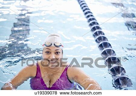 Woman at edge of swimming pool View Large Photo Image Stock Photo - Woman at edge of swimming pool. Fotosearch