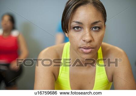 Woman exercising at gym View Large Photo Image Stock Photograph - Woman exercising at gym. Fotosearch