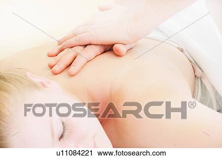 Woman having back massage in spa View Large Photo Image Stock Image - Woman having back massage in spa. Fotosearch