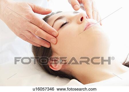 Woman having facial massage in spa View Large Photo Image Stock Photograph - Woman having facial massage in spa. Fotosearch