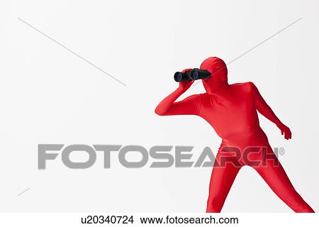Picture - Woman in bodysuit using binoculars. Fotosearch