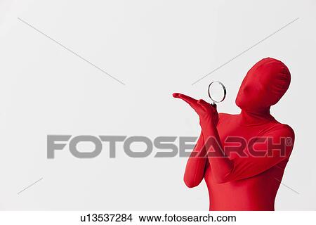 Woman in bodysuit with magnifying glass View Large Photo Image Picture - Woman in bodysuit with magnifying glass. Fotosearch