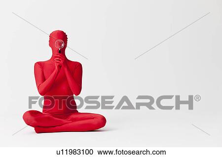 Stock Image - Woman in bodysuit with magnifying glass. Fotosearch