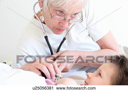 Woman listening to girls heartbeat View Large Photo Image Stock Image - Woman listening to girls heartbeat. Fotosearch