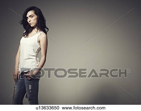 Woman posing with gray background View Large Photo Image Stock Image - Woman posing with gray background. Fotosearch