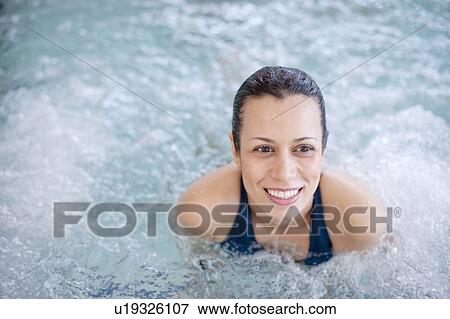 Woman relaxing in jacuzzi tub View Large Photo Image Stock Photo - Woman relaxing in jacuzzi tub. Fotosearch