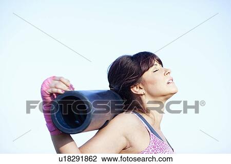 Woman resting head on pole outdoors View Large Photo Image Stock Image - Woman resting head on pole outdoors. Fotosearch