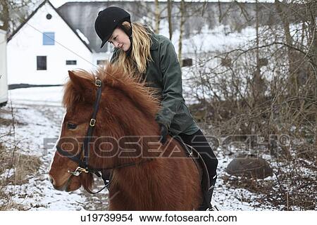 Woman riding horse in snow View Large Photo Image Picture - Woman riding horse in snow. Fotosearch