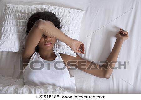 Stock Photography - Woman sleeping in bed. Fotosearch