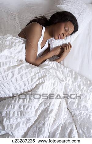 Woman sleeping in bed View Large Photo Image Stock Photography - Woman sleeping in bed. Fotosearch
