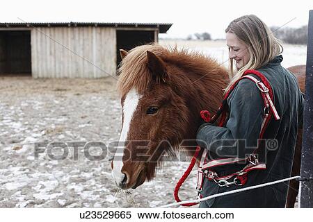 Woman smiling with horse in yard View Large Photo Image Stock Photography - Woman smiling with horse in yard. Fotosearch