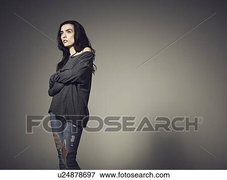 Woman standing with arms crossed View Large Photo Image Stock Photo - Woman standing with arms crossed. Fotosearch