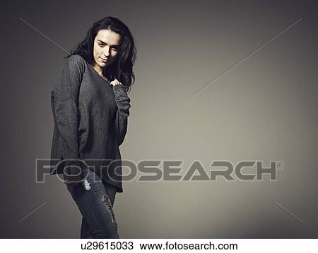 Woman wearing baggy sweatshirt View Large Photo Image Stock Image - Woman wearing baggy sweatshirt. Fotosearch