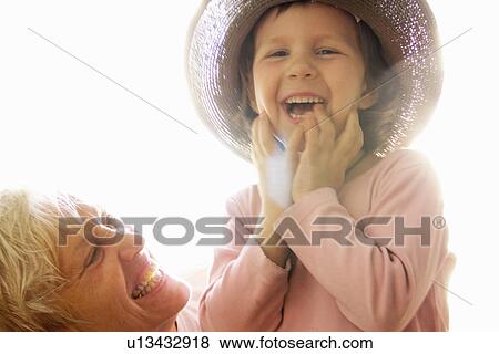 Stock Photo - Woman with granddaughter outdoors. Fotosearch