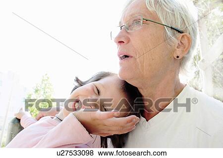 Stock Photo - Woman with granddaughter outdoors. Fotosearch