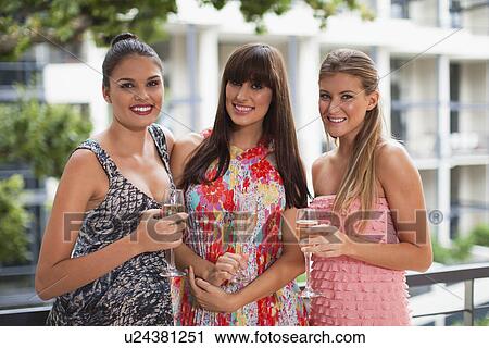 Women drinking champagne together View Large Photo Image Stock Image - Women drinking champagne together. Fotosearch