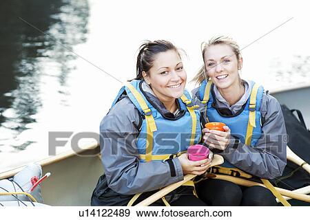 Women having coffee in canoe View Large Photo Image Stock Photo - Women having coffee in canoe. Fotosearch