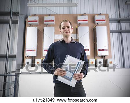 Worker at solar panel controls View Large Photo Image Stock Photo - Worker at solar panel controls. Fotosearch