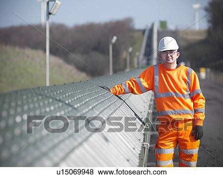 Worker by conveyor at coal mine View Large Photo Image Stock Photo - Worker by conveyor at coal mine. Fotosearch