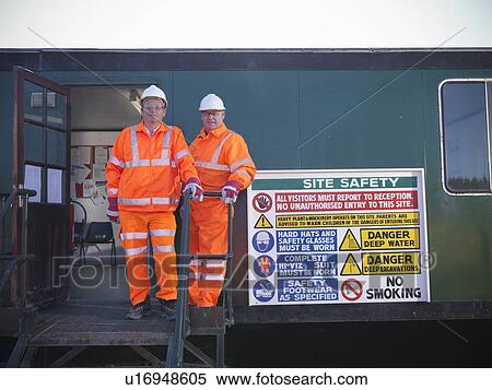 Workers by safety sign at coal mine View Large Photo Image Stock Photography - Workers by safety sign at coal mine. Fotosearch