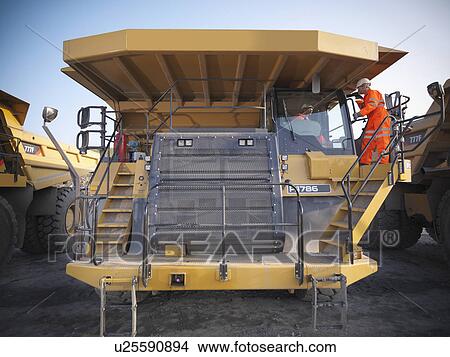 Picture - Workers on equipment in coal mine. Fotosearch