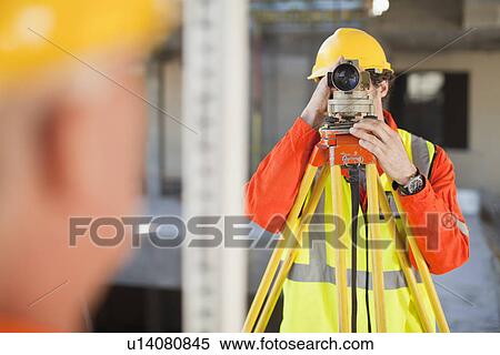 Workers using equipment on site View Large Photo Image Stock Photography - Workers using equipment on site. Fotosearch