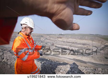 Workers walking in coal mine View Large Photo Image Stock Image - Workers walking in coal mine. Fotosearch