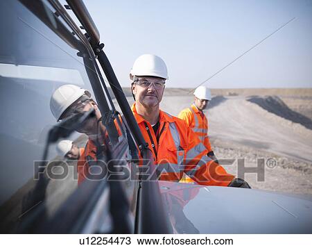 Workers with equipment in coal mine View Large Photo Image Stock Image - Workers with equipment in coal mine. Fotosearch