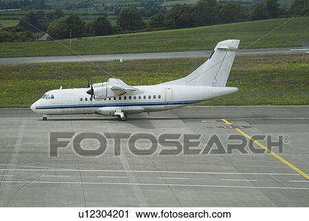 Stock Image - Airplane on the runway, Cork Airport, Cork, County Cork, Republic of Ireland. Fotosearch