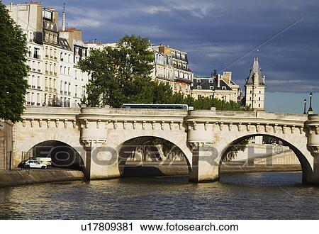 Stock Image - Arch bridge across the river, Pont Neuf, Seine River, Paris, France. Fotosearch