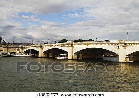 Arch bridge across the river, Seine River, Paris, France View Large Photo Image Stock Photo - Arch bridge across the river, Seine River, Paris, France. Fotosearch