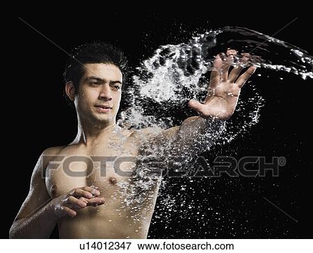 Bare chested man splashed with water View Large Photo Image Stock Photo - Bare chested man splashed with water. Fotosearch