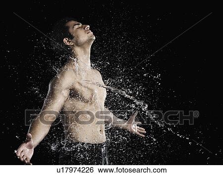 Bare chested man splashed with water View Large Photo Image Stock Photograph - Bare chested man splashed with water. Fotosearch