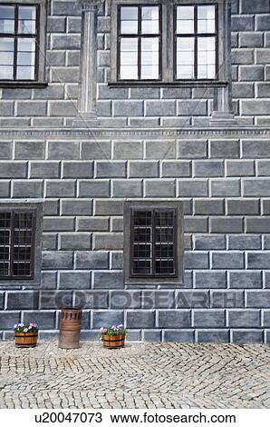 Baskets of flowers in front of a building, Cesky Krumlov, South Bohemian Region, Czech Republic View Large Photo Image Stock Image - Baskets of flowers in front of a building, Cesky Krumlov, South Bohemian Region, Czech Republic. Fotosearch