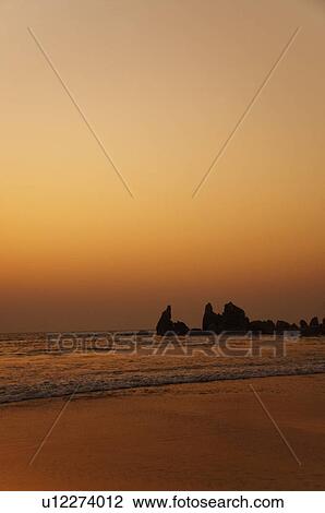 Stock Image - Beach at dusk, Goa, India. Fotosearch