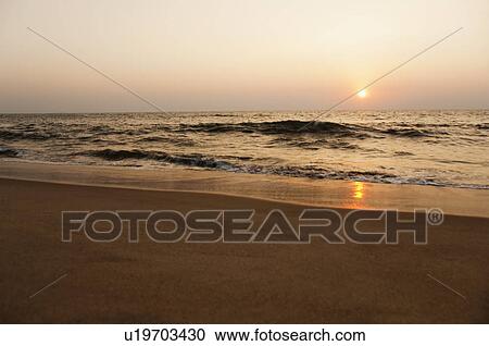 Stock Image - Beach at sunset, Goa, India. Fotosearch
