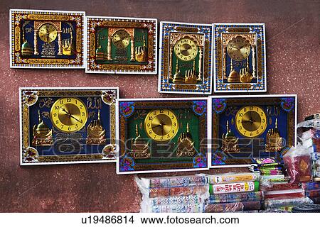 Picture - Books with clocks at a market stall, Delhi, India. Fotosearch