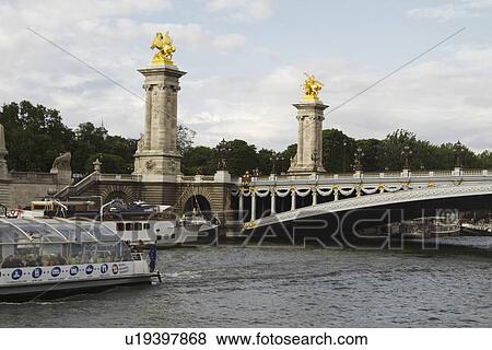 Bridge across the river, Pont Alexandre III, Seine River, Paris, France View Large Photo Image Stock Photo - Bridge across the river, Pont Alexandre III, Seine River, Paris, France. Fotosearch