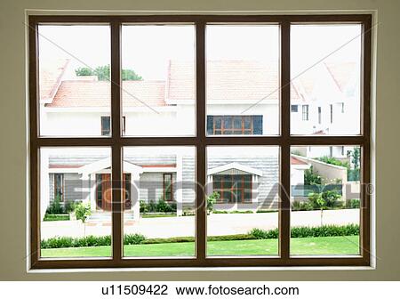 Stock Image - Bungalow viewed from a window, Bangalore, Karnataka, India. Fotosearch